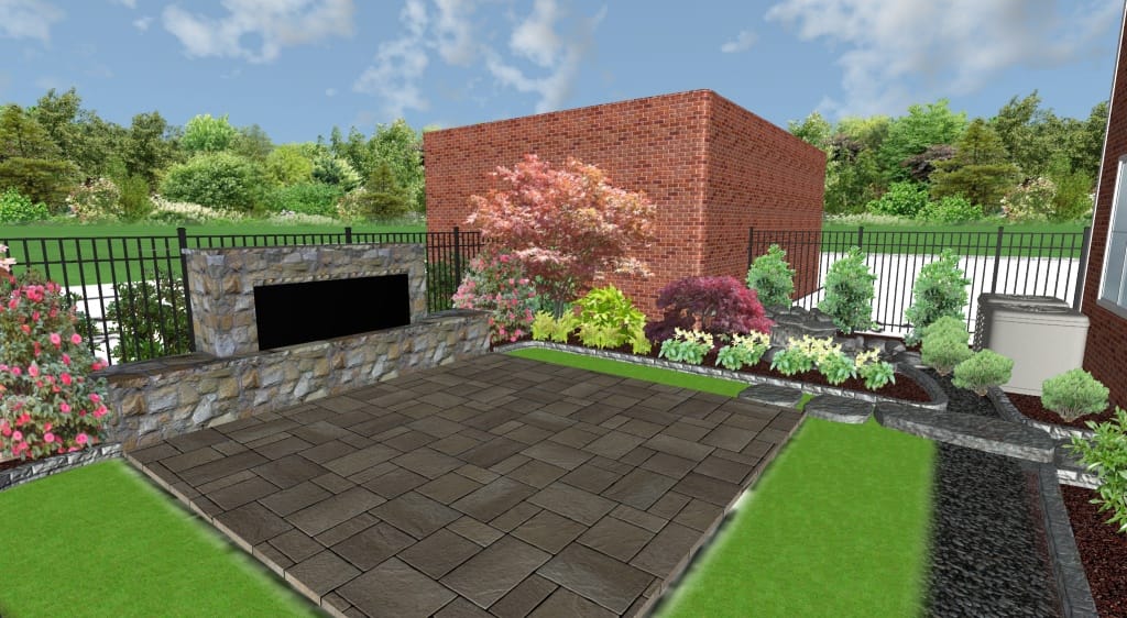 A landscaped backyard with a stone patio, outdoor fireplace, brick wall, dynamic content widget display, various shrubs, and a black metal fence under a partly cloudy sky.